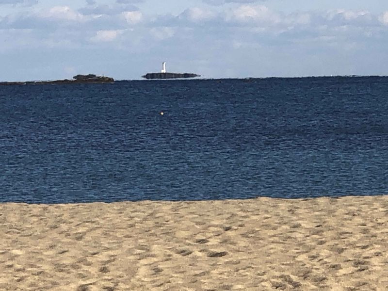 Kumano Private Tour - Floating rock island by a mirage from the sand beach behind Nachi station.