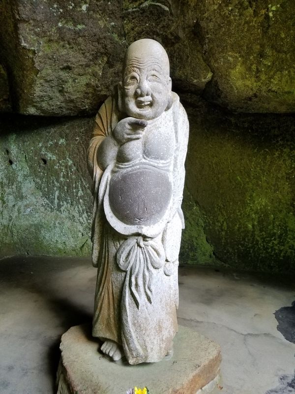 Kamakura Private Tour - The Statue of Happiness.  He really looks happy. 