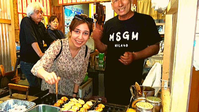 Osaka Private Tour - Do some taste testing at a delicous takyaki stall.
