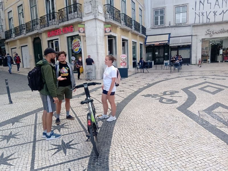 Lisbon Private Tour - Me sharing the story of royal family drama on Rossio square ( implicating civil war of two brothers ) to curious couple from Ukraine 
