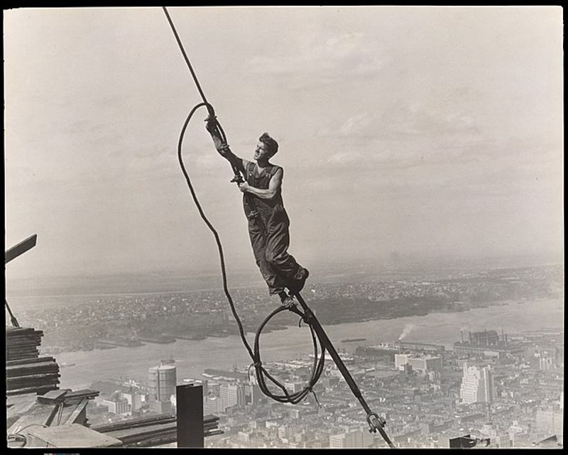 New York Private Tour - "Icarus, Empire State Building", by Lewis Hine. A worker during the Empire State Building construction 
