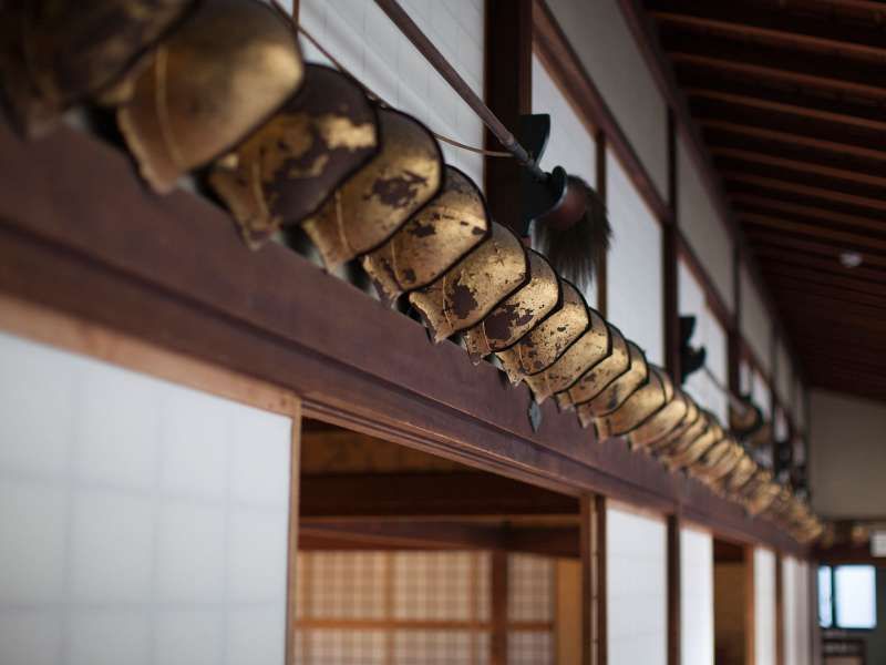 Fukuoka Private Tour - In the Ohana house. Pear-shaped helmets in the feudal age are displayed along the corridor.