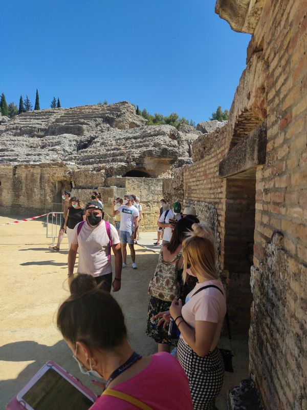 Seville Private Tour - Guiding a group in Itálica