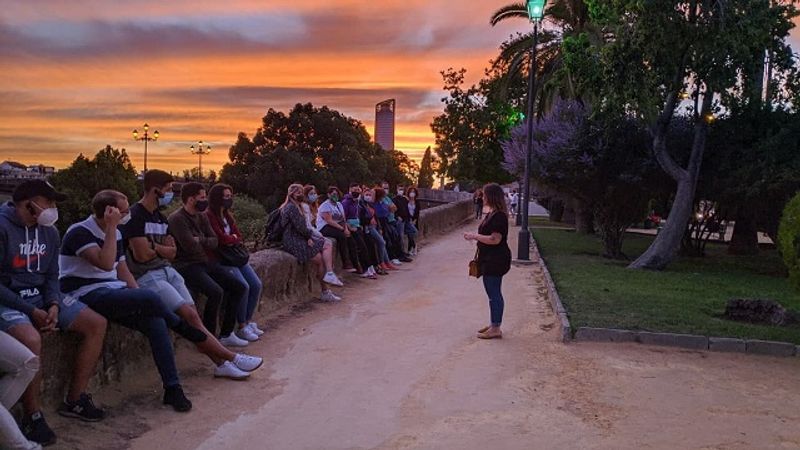 Seville Private Tour - Guiding a group during the sunset in the Triana Tour