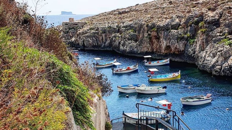 Malta Private Tour - This location is Wied iz-Zurrieq from above. The word Wied is a Maltese word means valley, here is the end of the valley from where one takes a boat to Blue Grotto. From Blue Grotto we finish here again where one may eat something like local fish from   restaurants around here.