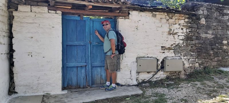 Tirana Private Tour - Dori knocking the door in Permet