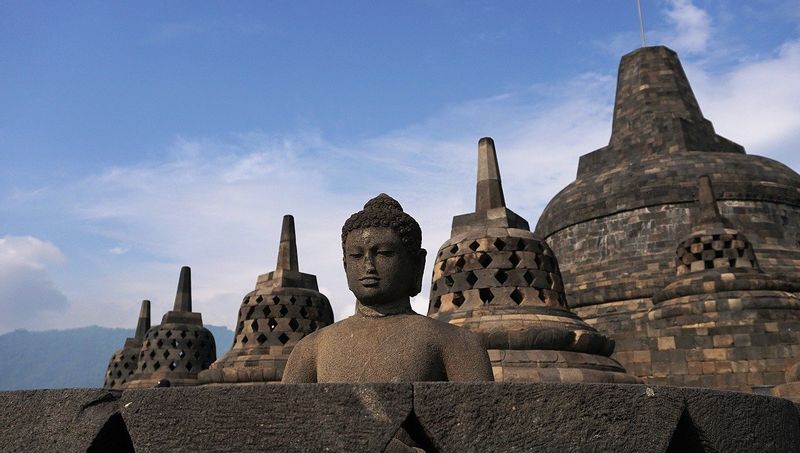 Yogyakarta Private Tour - A statue of Buddha inside uncovered stupa