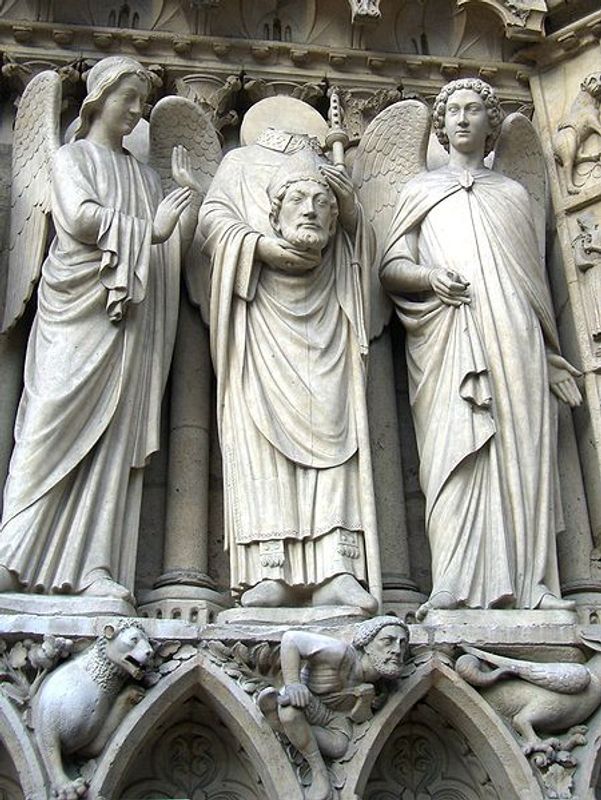 Paris Private Tour - Statue of Saint-Denis beheaded, on the left portail of Notre-Dame