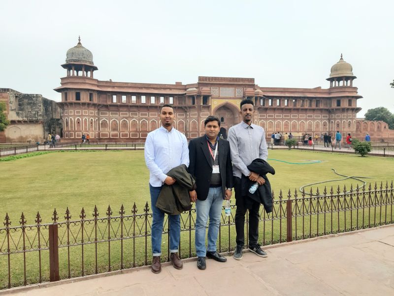 Agra Private Tour - Picture clicked in Agra fort with the background of Jahangir's palace with clients from Sudan.