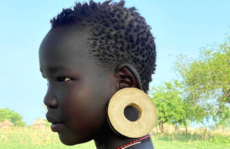 Addis Ababa Private Tour - Mursi tribe young girl.