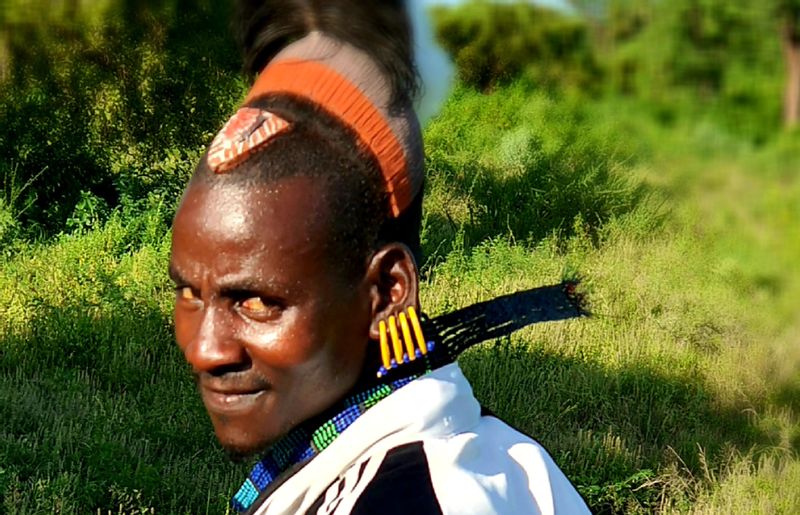 Addis Ababa Private Tour - A young man of the Hamar tribe with a unique traditional hair style 