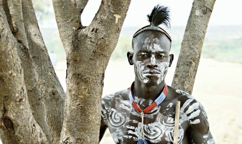 Addis Ababa Private Tour - A Kara tribe man with traditional body painting 