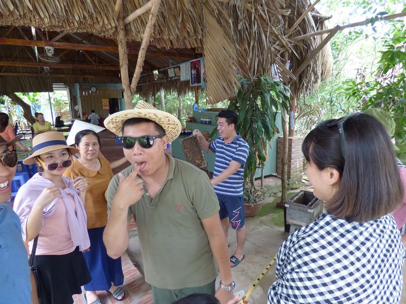 Ho Chi Minh Private Tour - tasting honey and coconut candy