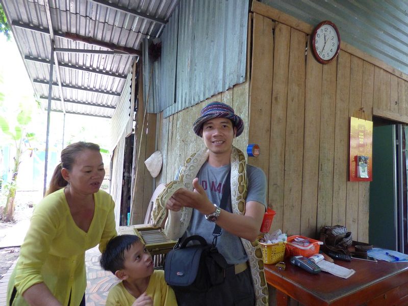 Ho Chi Minh Private Tour - selfie with python in the fruit yard