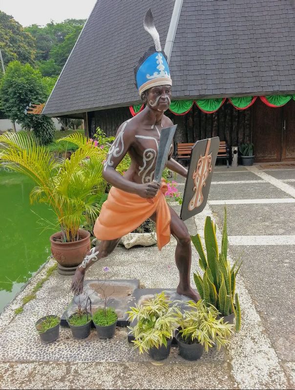 Jakarta Private Tour - A statue in front of traditional house