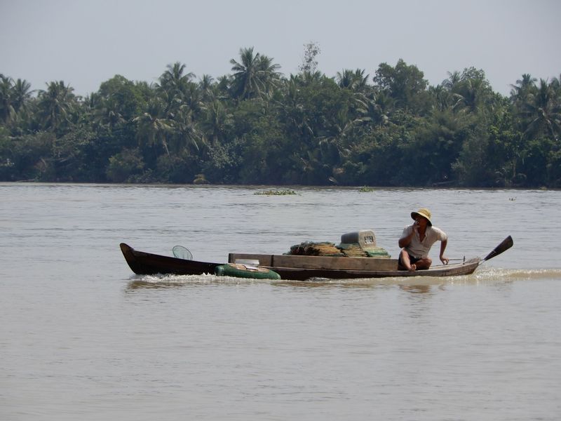 Ho Chi Minh Private Tour - local fishermen on their little boat.