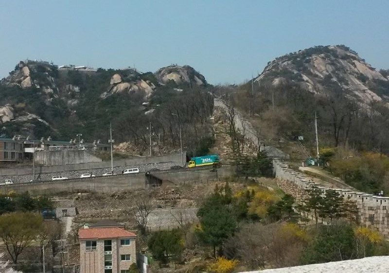 Seoul Private Tour - Grand View of Inwang-san as we stroll up by the City Fortress Wall.  We are going to the mid-slope of the left part!