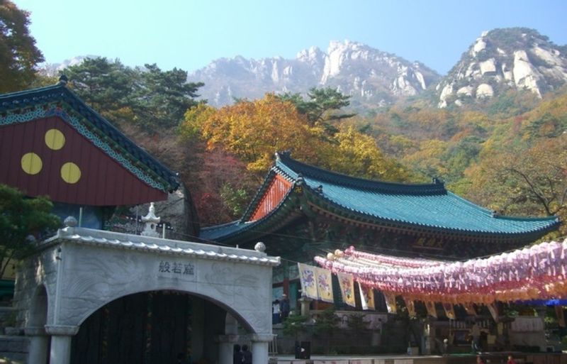 Seoul Private Tour - Doseon-sa Temple with the Three-Horns Peaks soaring above.