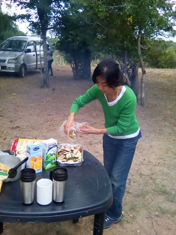 Livingstone Private Tour - Preparing a meal at camp