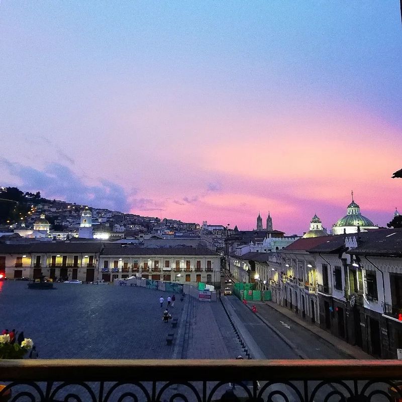 Quito Private Tour - Sunset San Francisco Square, in the distance La Compañia Domes, Basilica Neo-Gothic Towers, San Juan neighborhood covering the Hill with the same name  