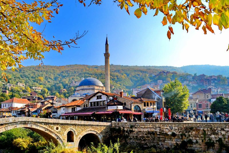 Prizren Private Tour - The old stone bridge of Prizren Kosovo with in the background the Kaljaja fortress and the Sinan Pasha mosque.