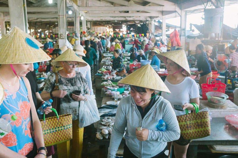 Hoi An Private Tour - at the market and choose the vegetable, sesame...