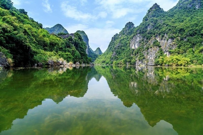 Hanoi Private Tour - on the small boat to visit Tam Coc