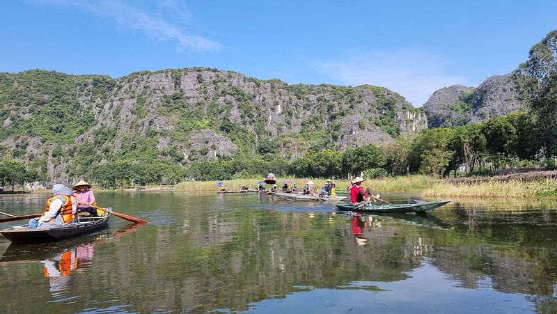 Hanoi Private Tour - on the small boat to visit Tam Coc