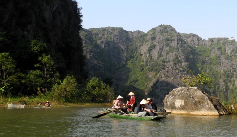 Hanoi Private Tour - on the small boat to visit Tam Coc