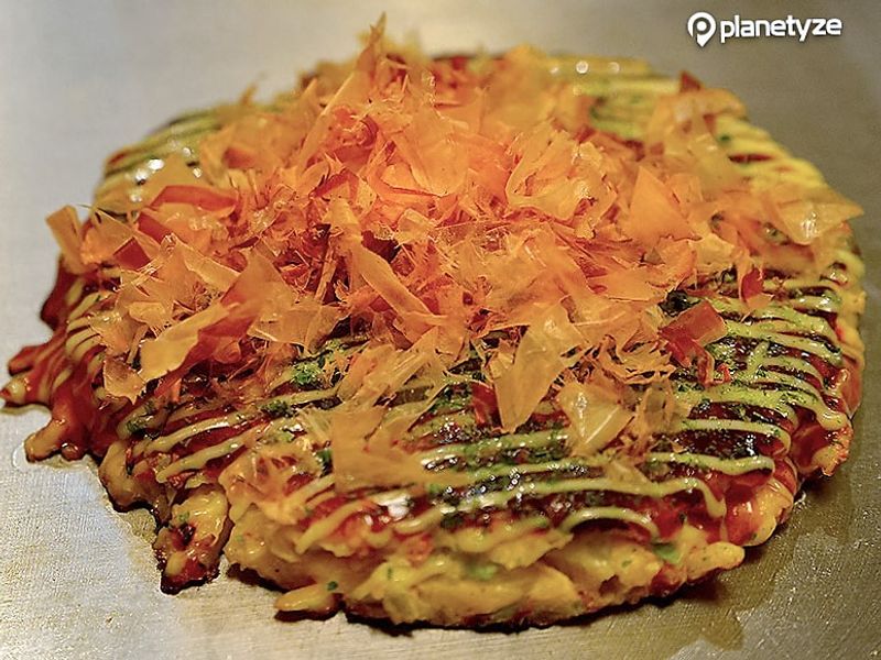 All of the okonomiyaki places in Osaka boast about their own flavors! It is the soul food of the local population.