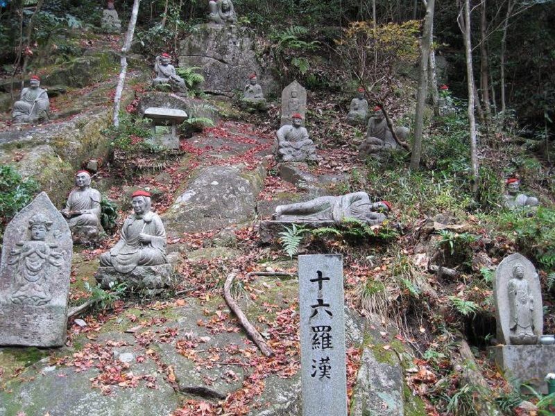The stone Buddha statues which seem to melt into nature