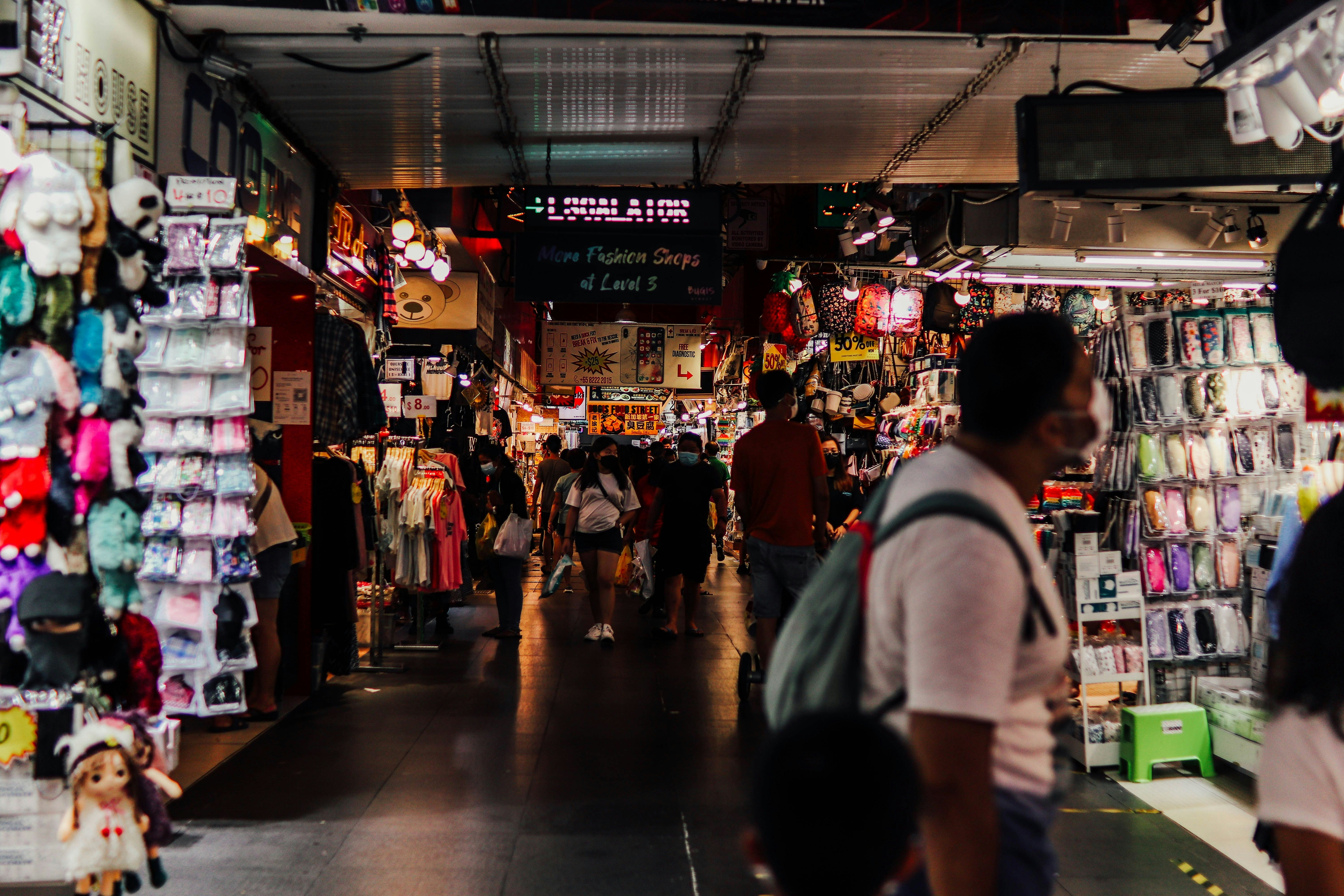 Stalls and people within the Bugis Market in Singapore