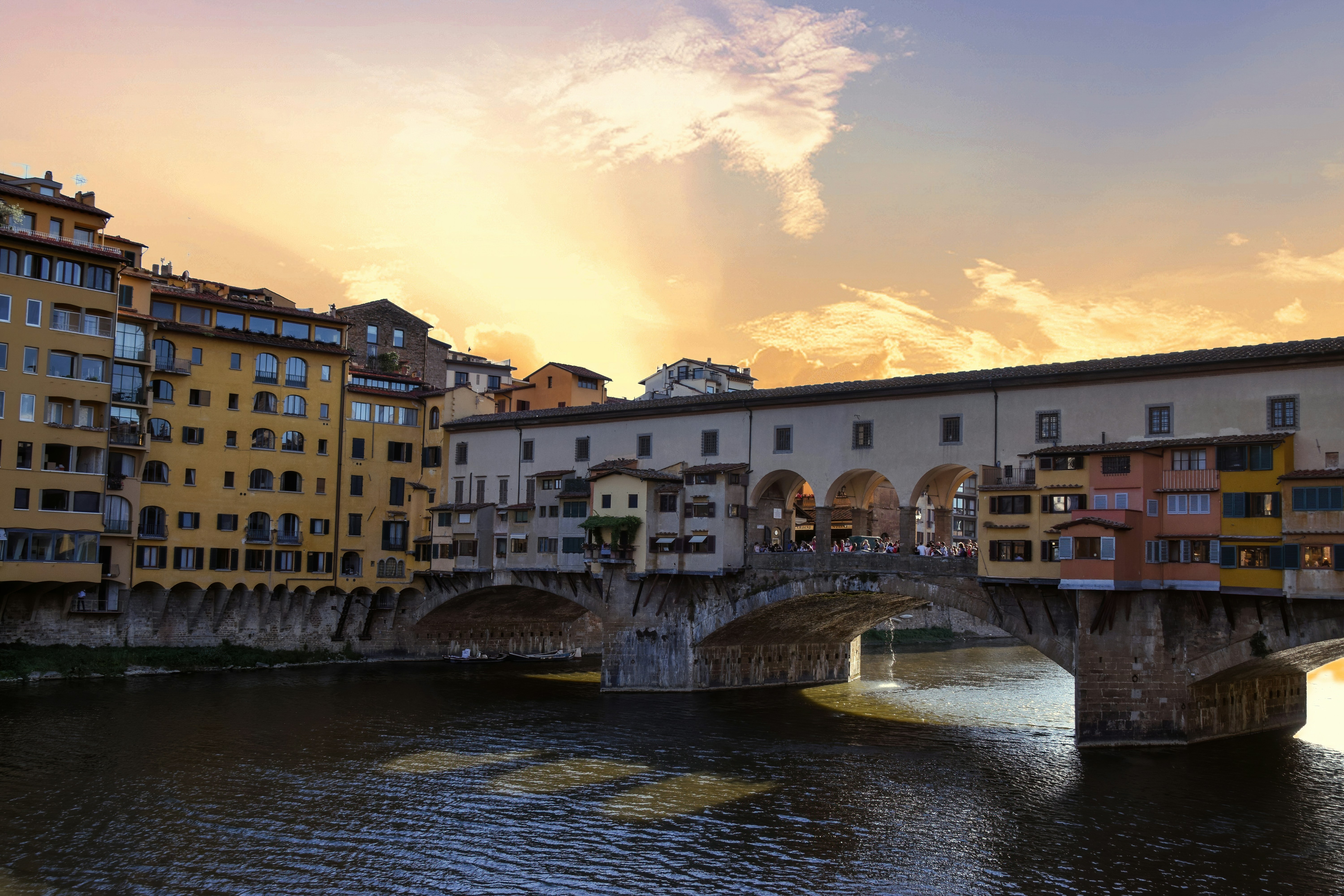 The Ponte Vecchio bridge in Florence Italy during sunset