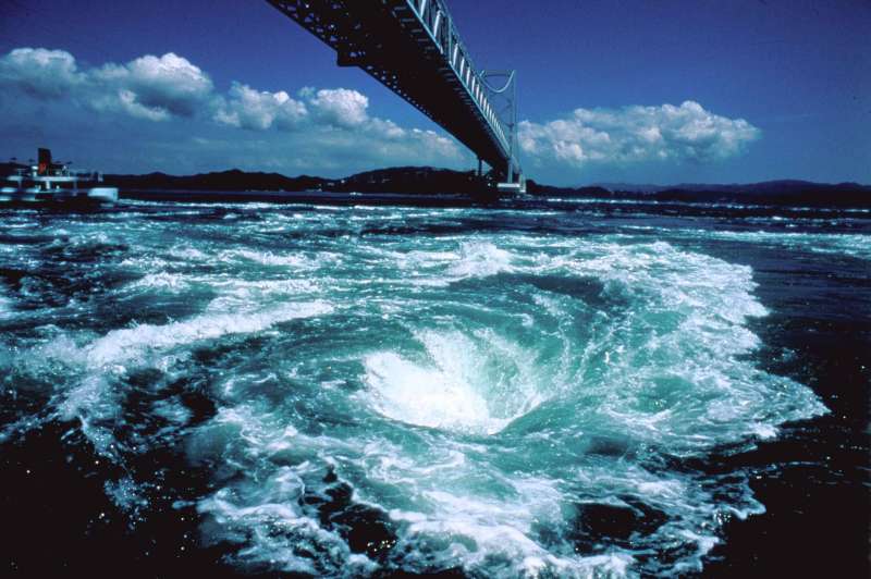 Naruto is the part of Tokushima Prefecture, Naruto is known for its swirling whirlpools. These can be seen in the Strait of Naruto underneath the Onaruto Bridge connecting Tokushima to Awaji Island.